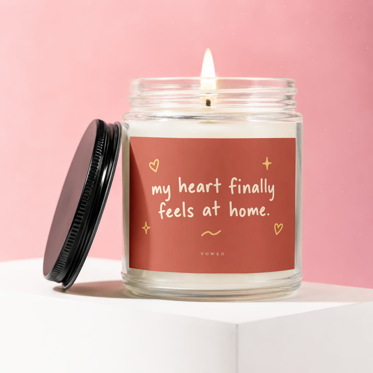 Candle with text "my heart finally feels at home." and brand "VOWED".