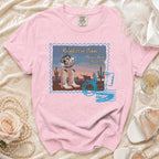 Pink t-shirt with "Reckless in Texas" graphic featuring cowboy boots and disco ball.