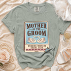 Sage green t-shirt with "Mother of the Groom Wedding Weekend Social Club" graphic.