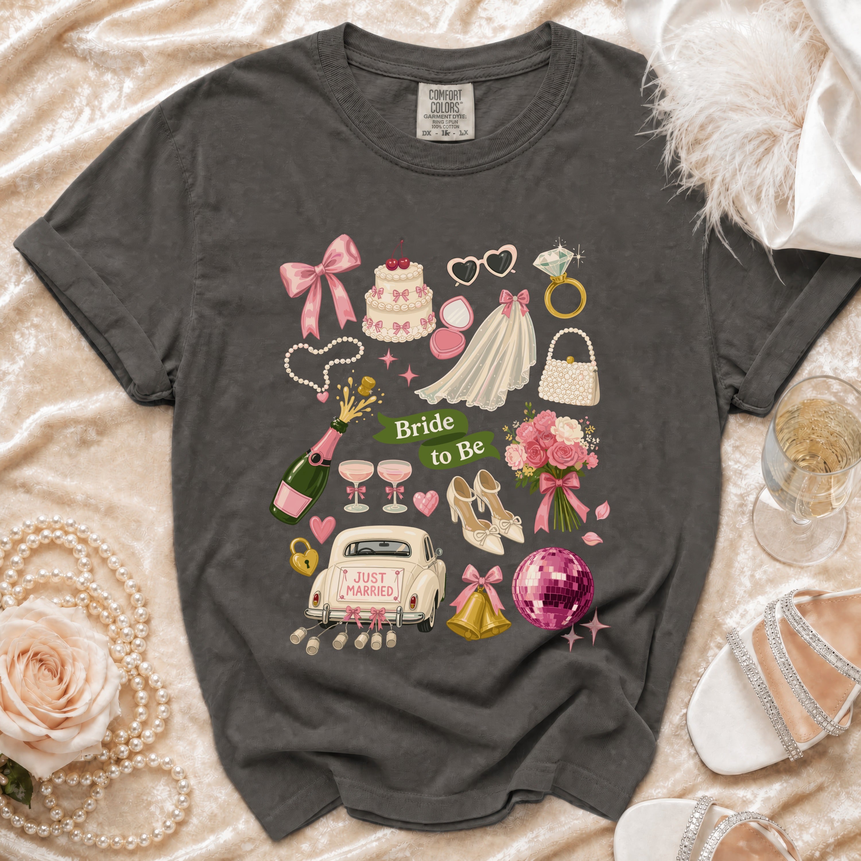 Dark grey t-shirt with "Bride to Be" design featuring wedding elements and "Just Married" car.