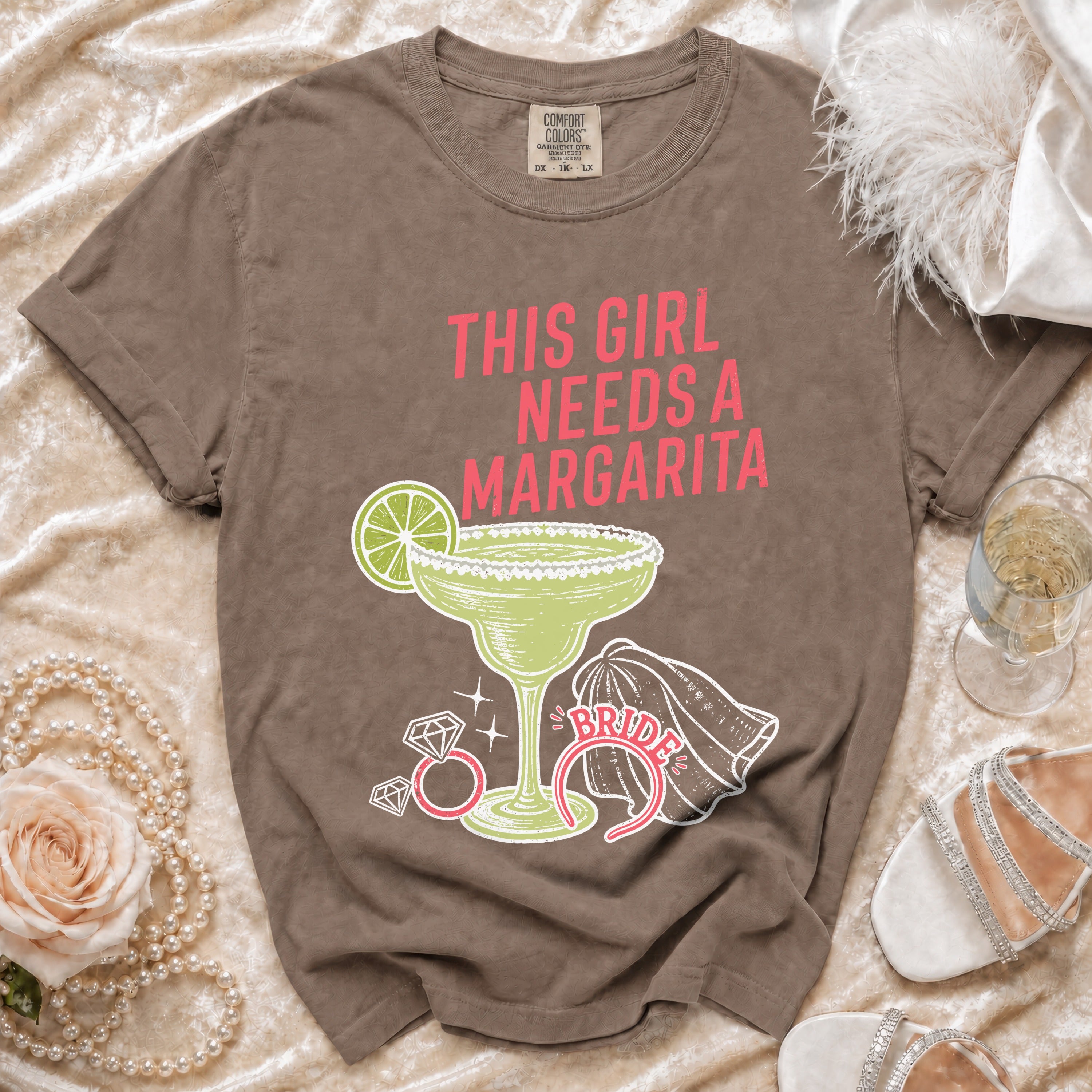 Brown t-shirt with "This Girl Needs a Margarita" graphic and margarita glass.