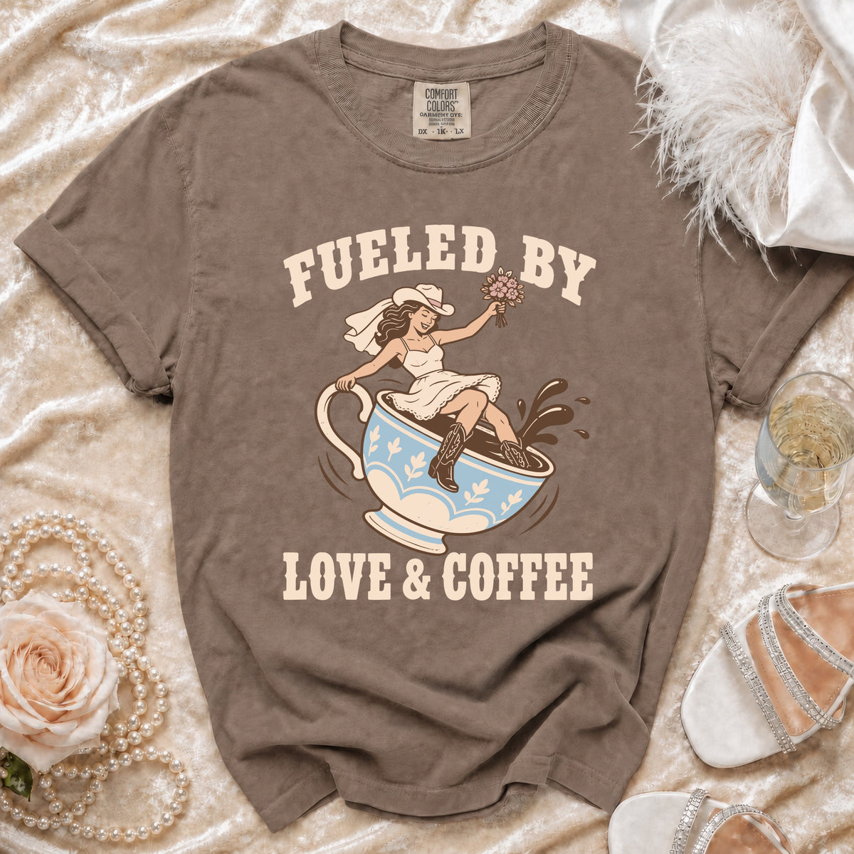 Brown t-shirt with graphic "Fueled by Love & Coffee" and bride in cowboy hat.