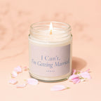 Scented candle in glass jar with lit wick, reads "I Can't, I'm Getting Married"