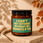 Amber candle with green label reading "I CAN'T GET HITHER WITHOUT MY FAVORITE B*TCH VOWED".
