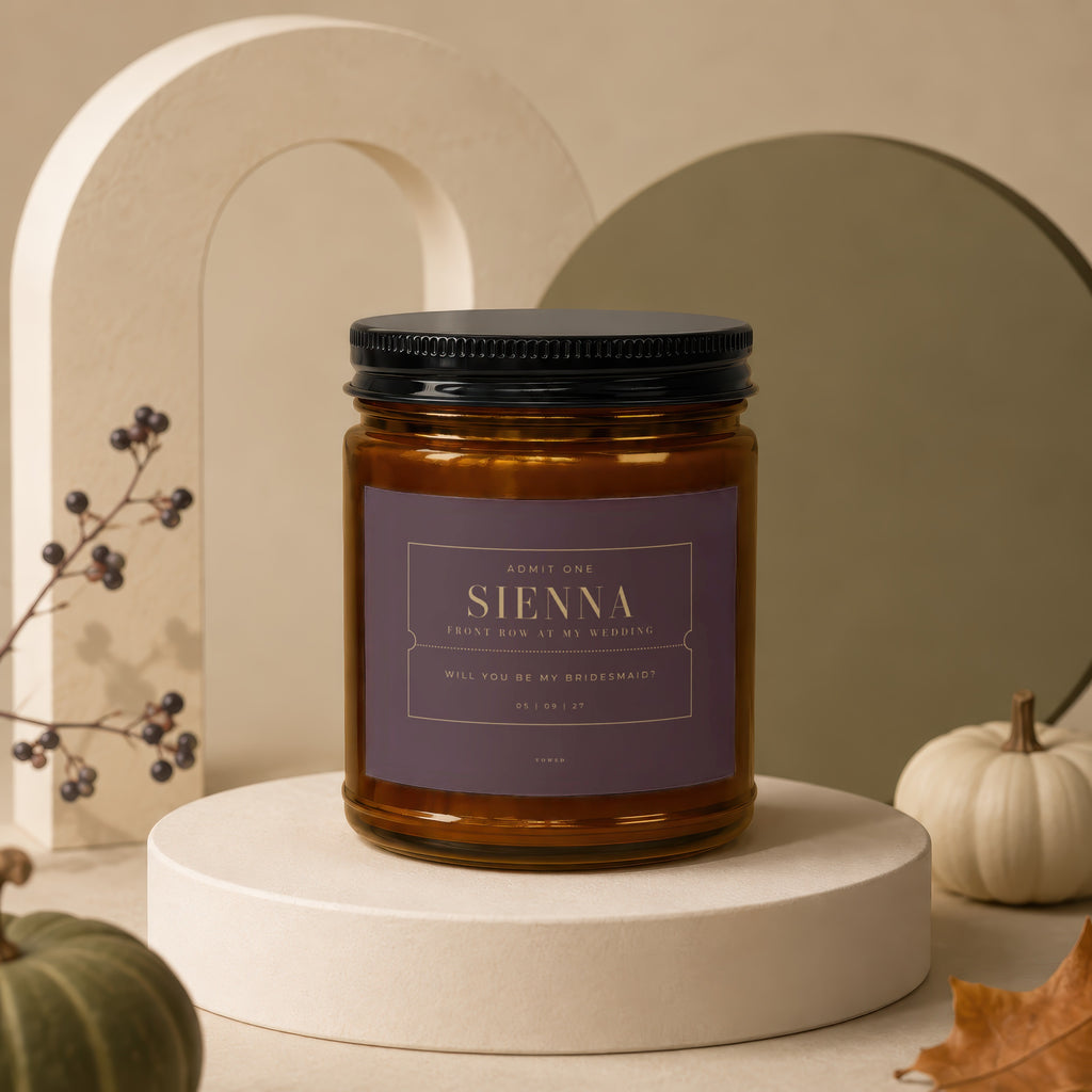 Amber jar candle with "Sienna, Will You Be My Bridesmaid?" label.