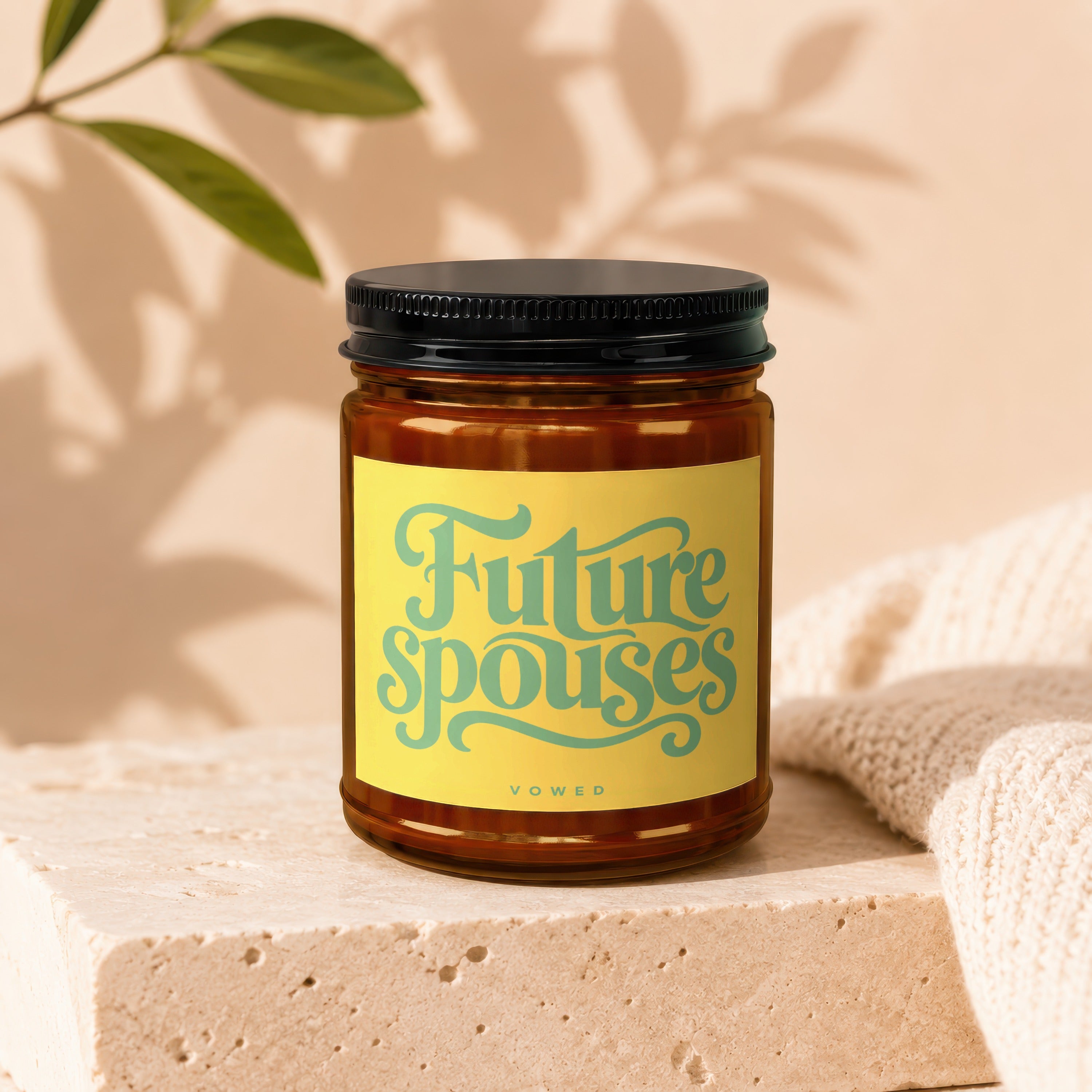 Amber jar candle with yellow label reading "Future spouses" above "VOWED".