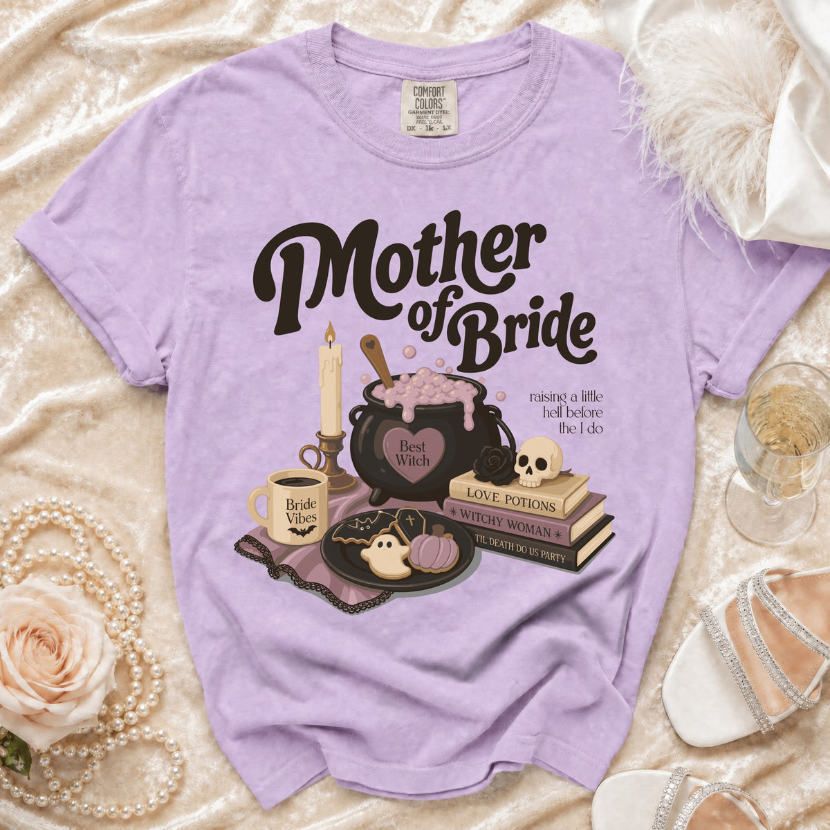Lilac t-shirt with "Mother of Bride" and witchy graphics.