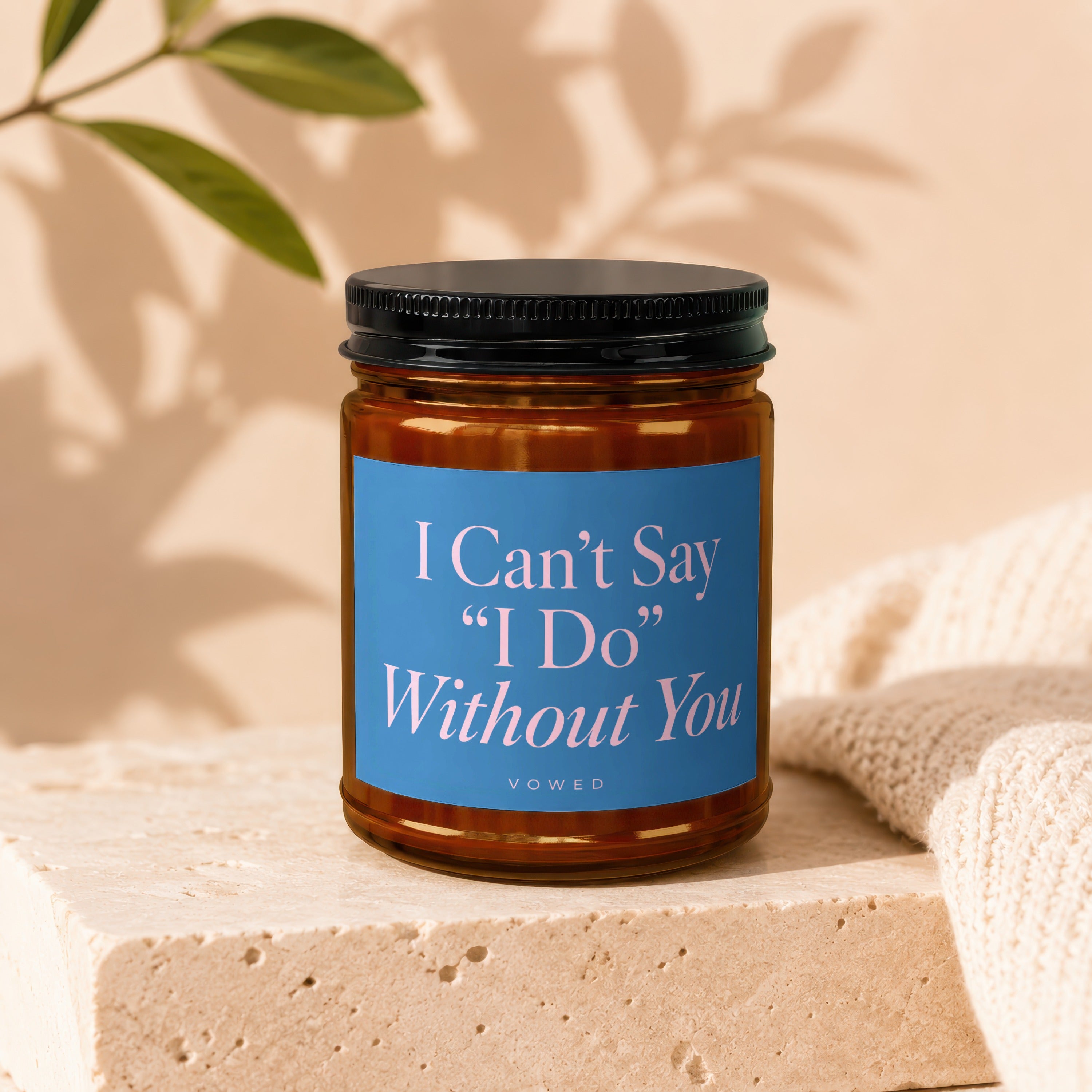 Candle with "I Can't Say 'I Do' Without You" text on blue label.