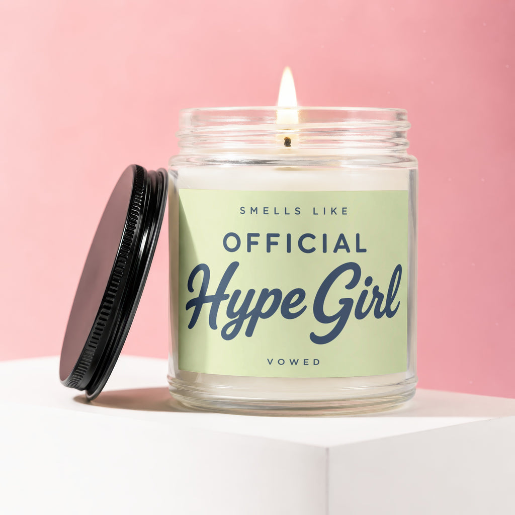 Jar candle with lit wick reads "Smells Like Official Hype Girl Vowed".