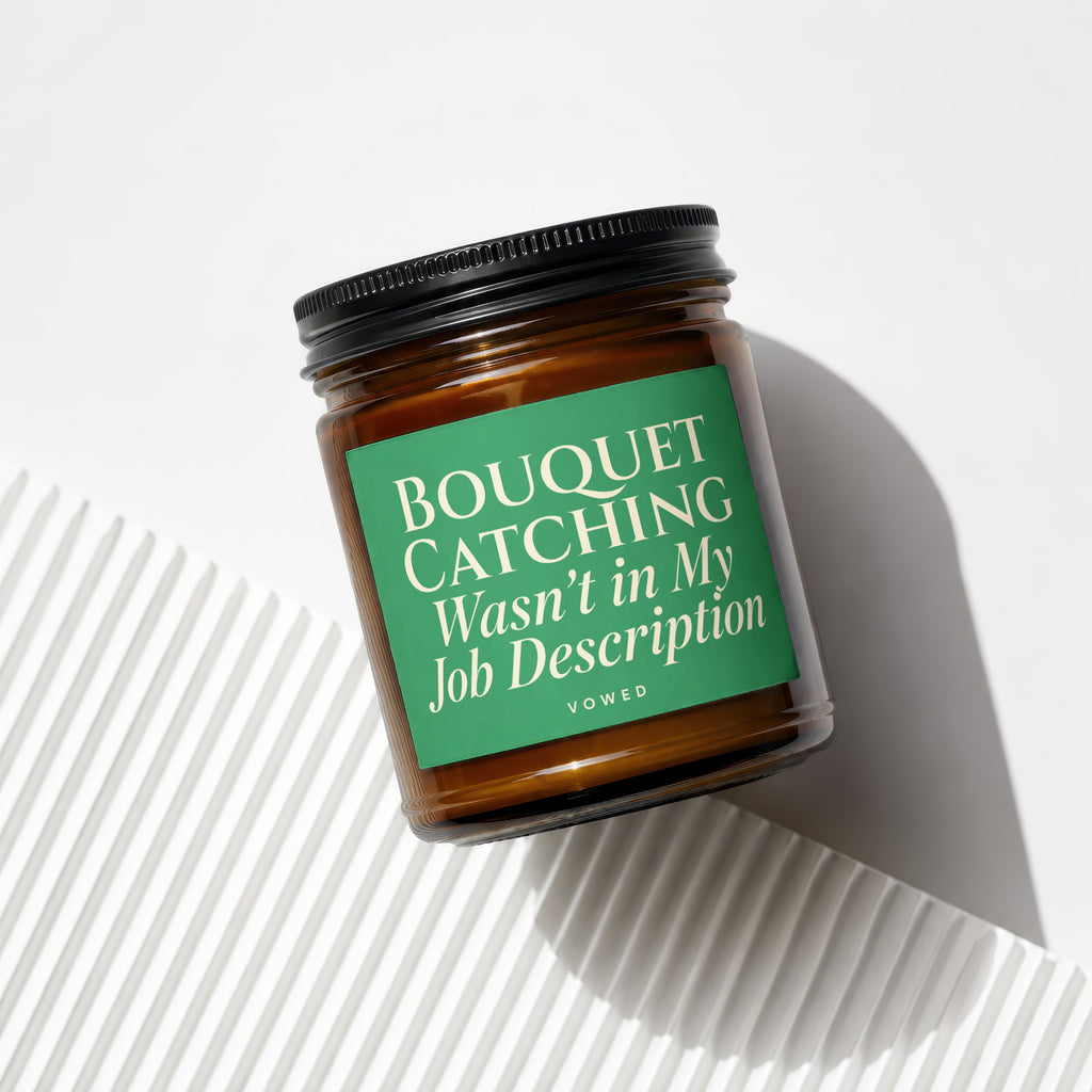 Amber candle in jar with green label reading "BOUQUET CATCHING Wasn't in My Job Description".
