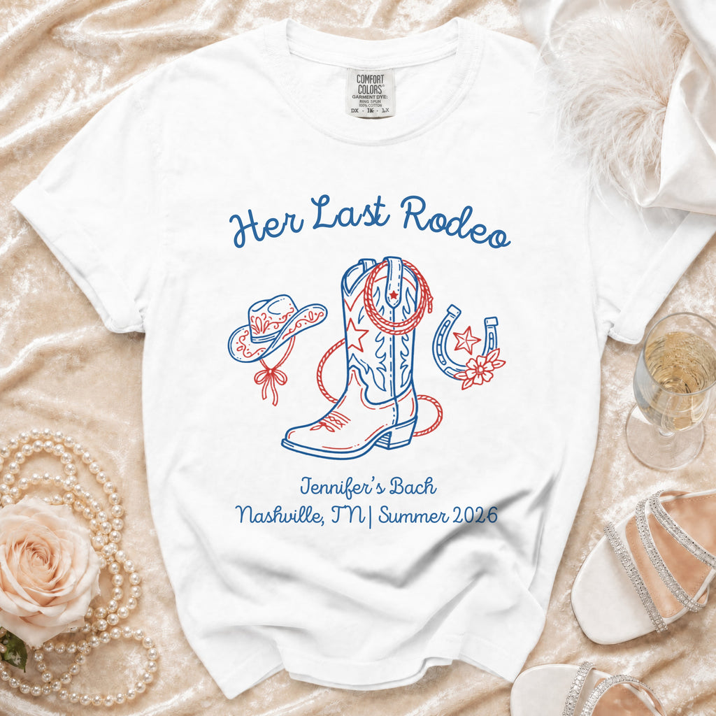 White t-shirt with "Her Last Rodeo" cowboy boot, hat, horseshoe, and event details.