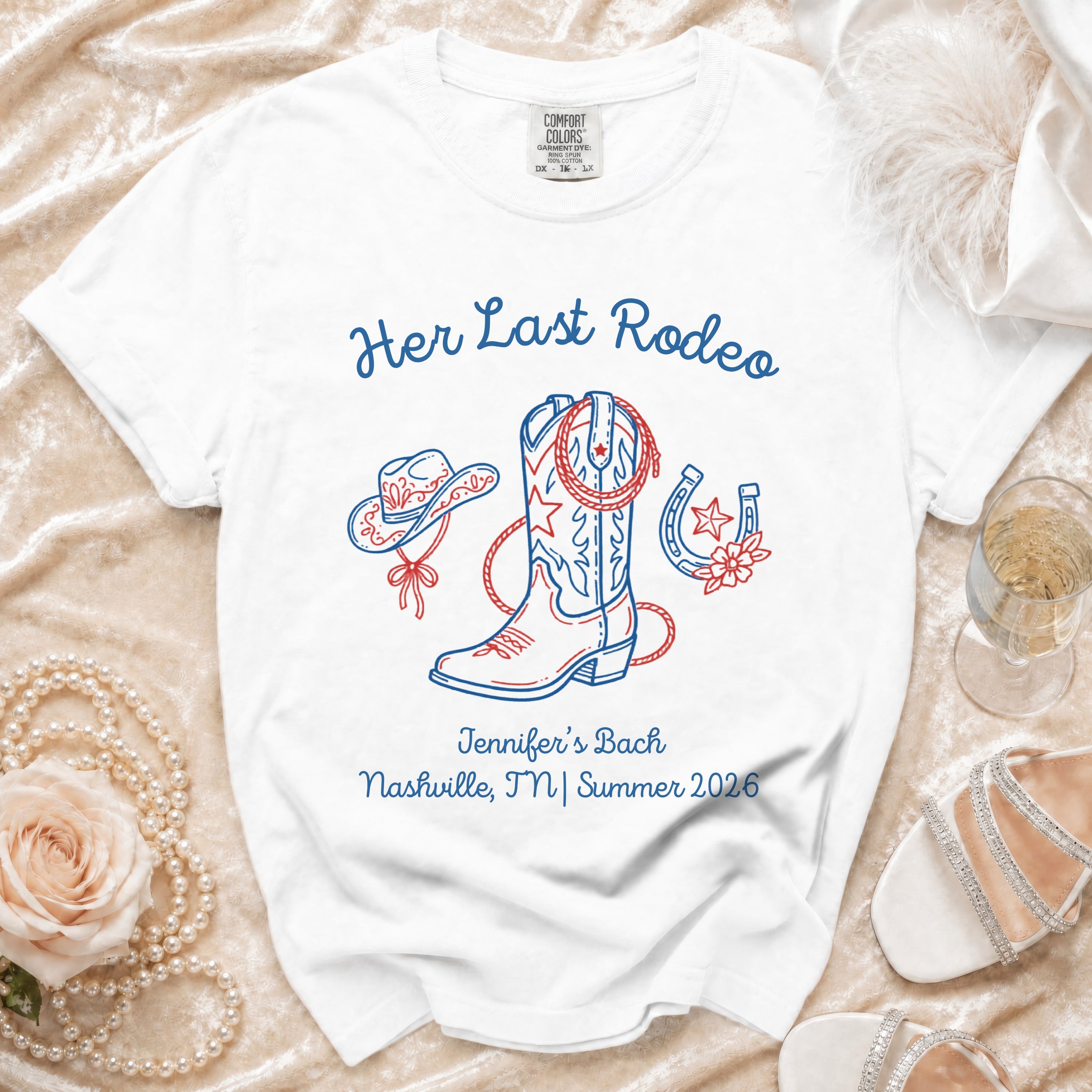 White t-shirt with "Her Last Rodeo" cowboy boot, hat, horseshoe, and event details.