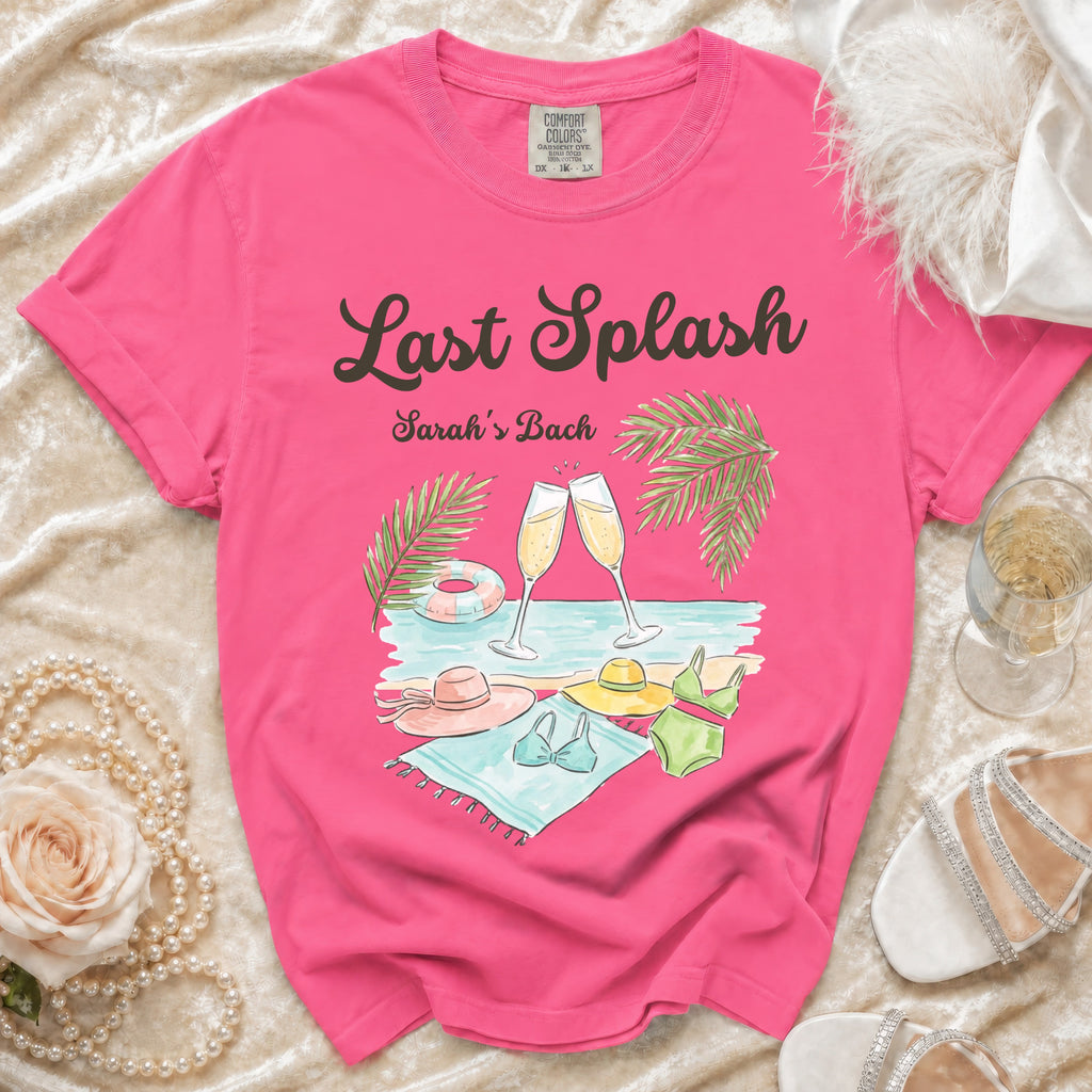 Pink t-shirt with "Last Splash Sarah's Bach" text and beach scene graphic.