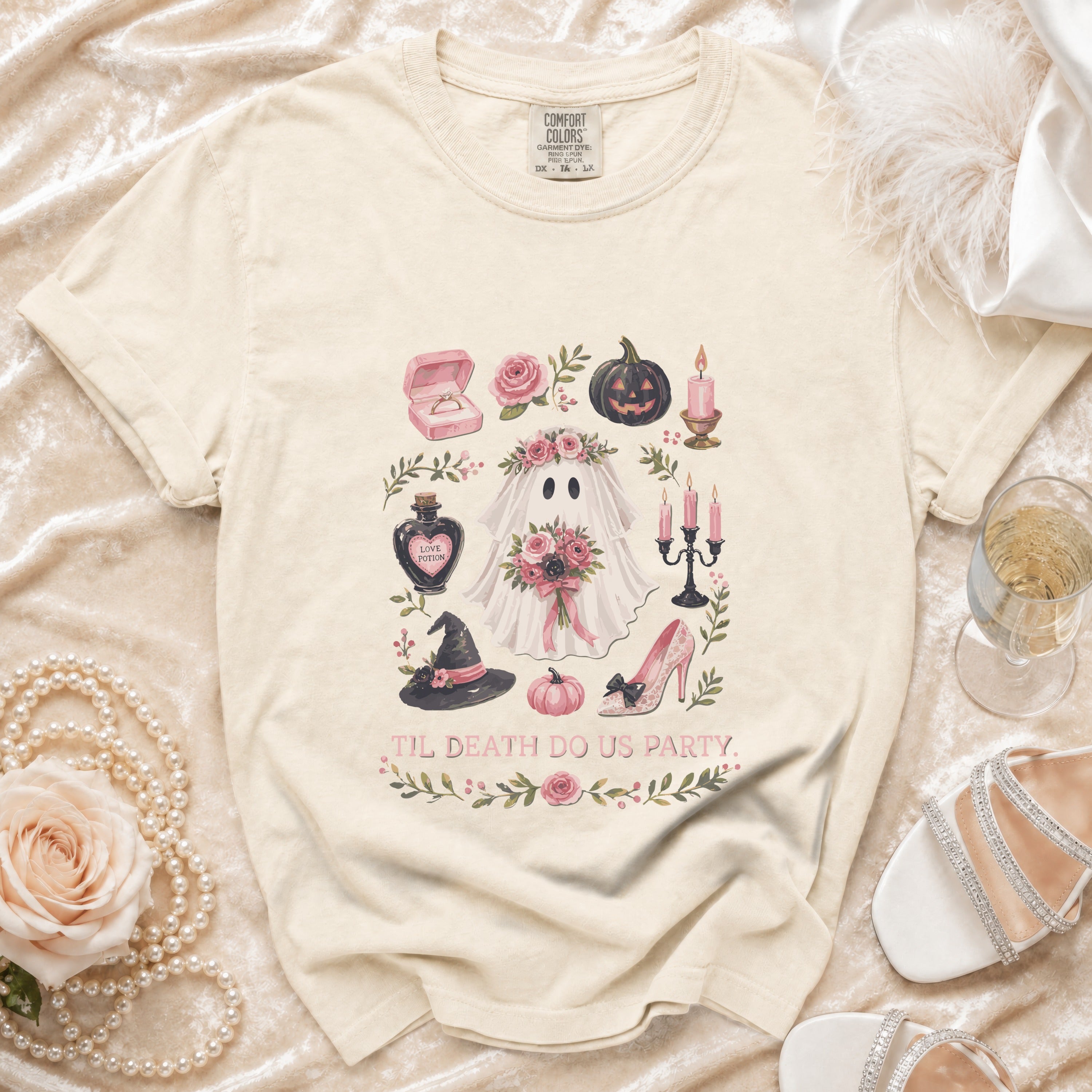 T-shirt with a watercolor graphic of a ghost bride and Halloween elements, reading "Til Death Do Us Party."