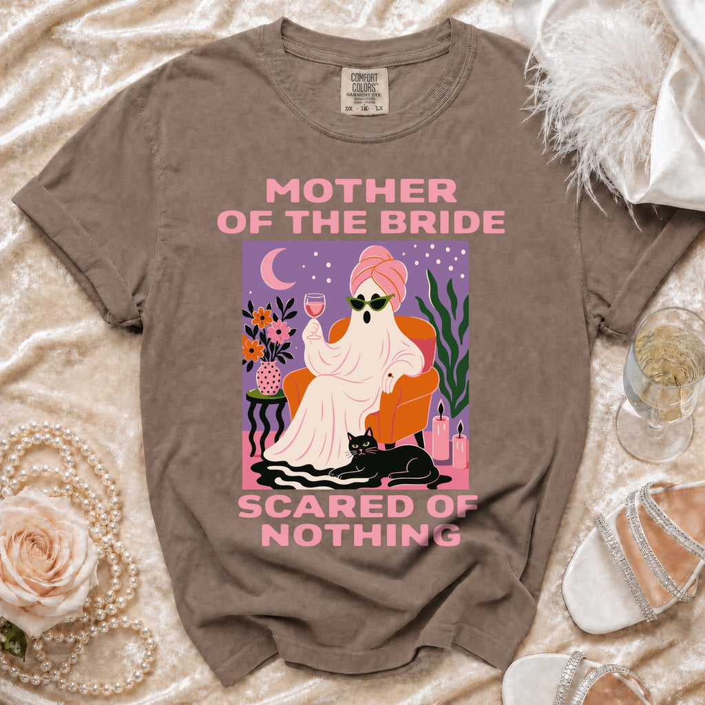 Brown t-shirt with "Mother of the Bride Scared of Nothing" graphic.