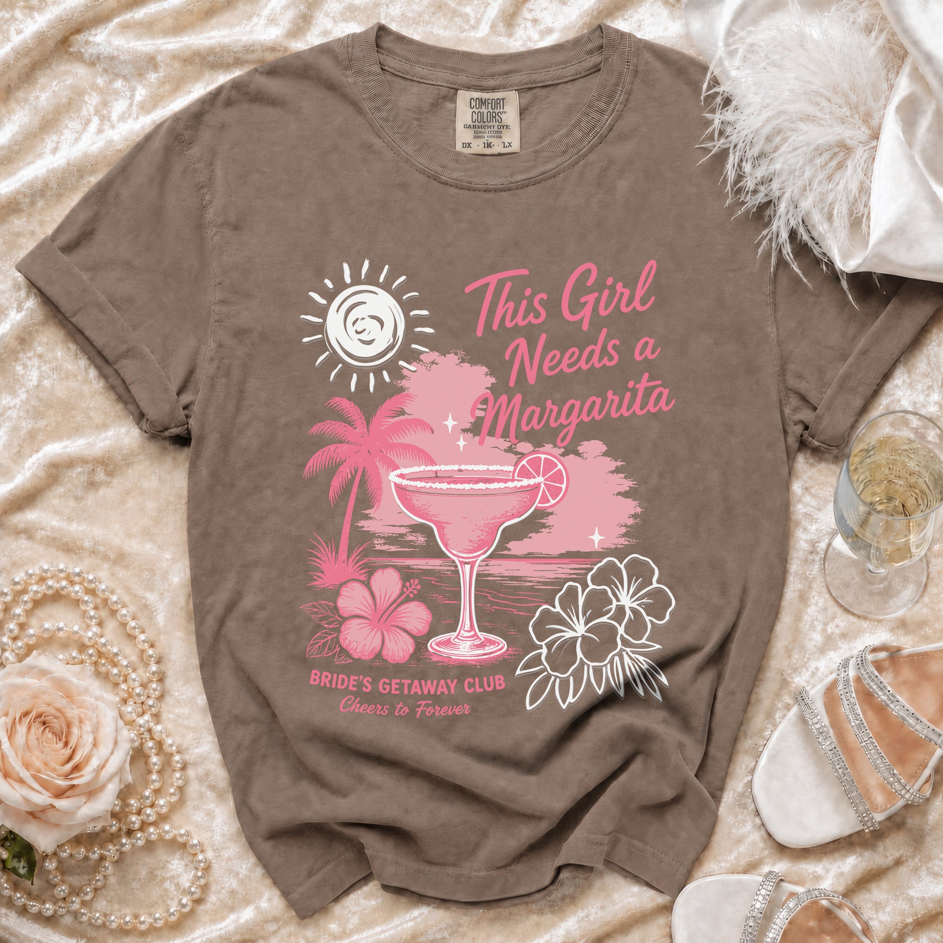 Brown t-shirt with "This Girl Needs a Margarita" graphic and "Bride's Getaway Club" text.