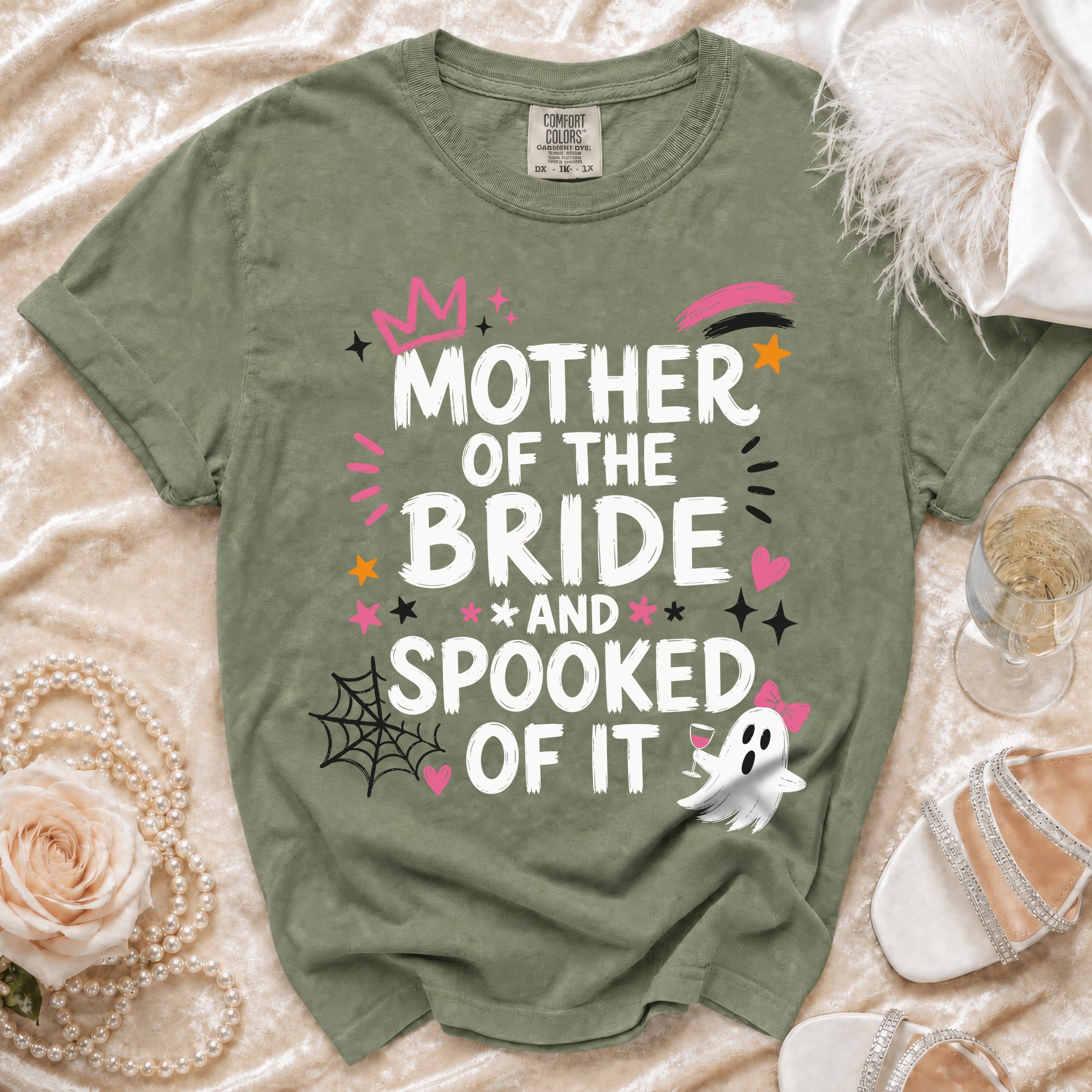 Green t-shirt with "Mother of the Bride and Spooked of It" text and Halloween graphics.
