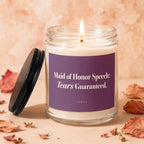 Lit candle with text "Maid of Honor Speech: Tears Guaranteed." on purple label.