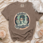 Brown t-shirt with "Veiled Unbothered" graphic of a bride holding a drink.