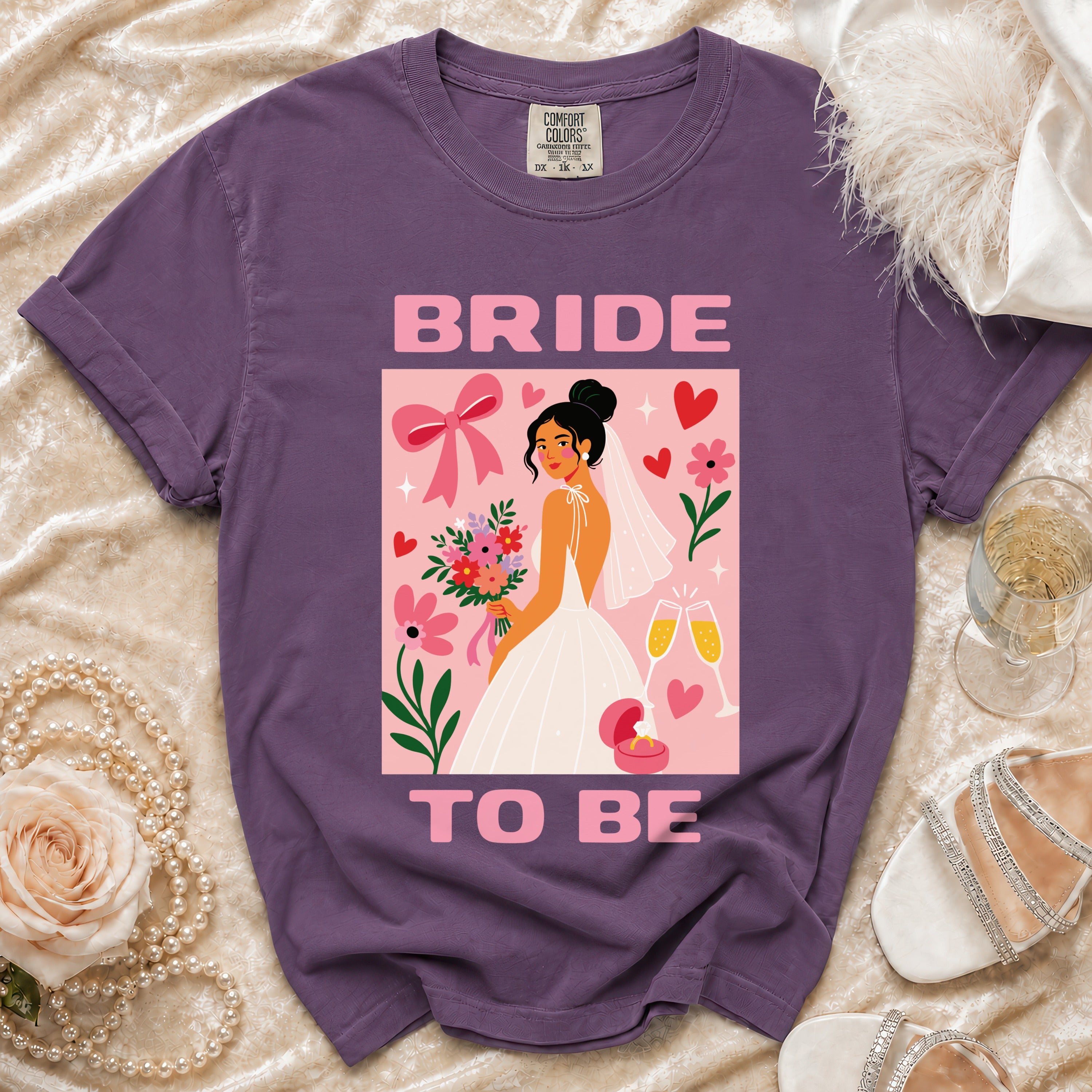 Purple t-shirt with a "Bride to Be" graphic and floral design.
