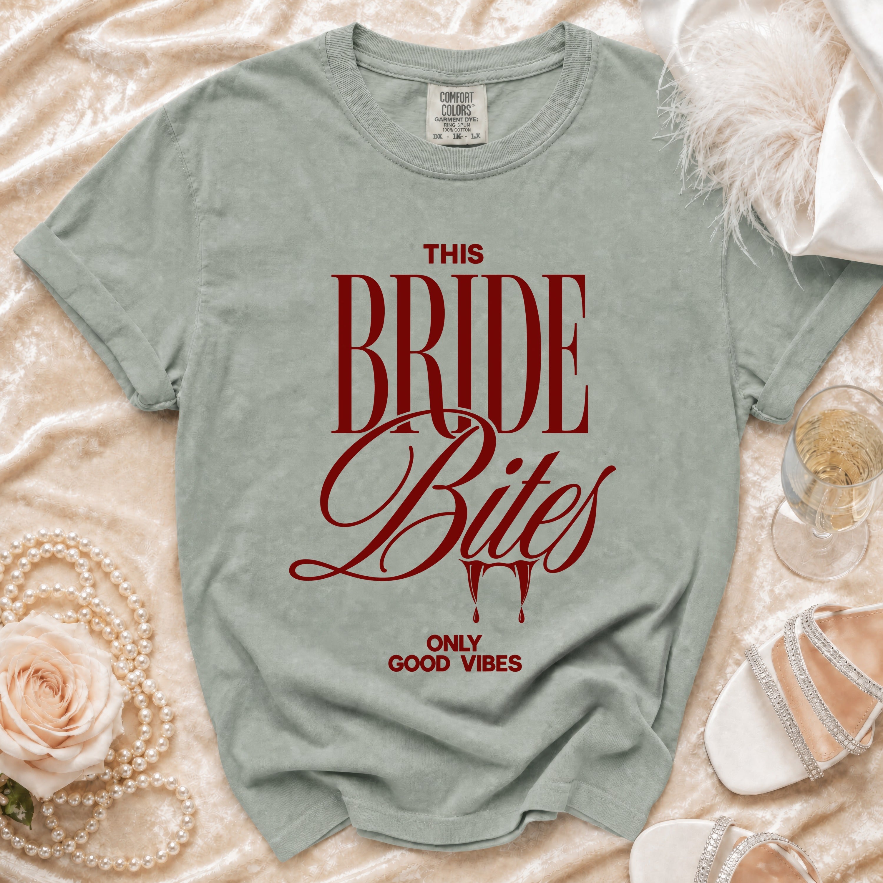 Sage t-shirt with red text "THIS BRIDE Bites ONLY GOOD VIBES".