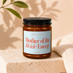Candle with label "Smells Like Mother of the Bride Energy VOWED".