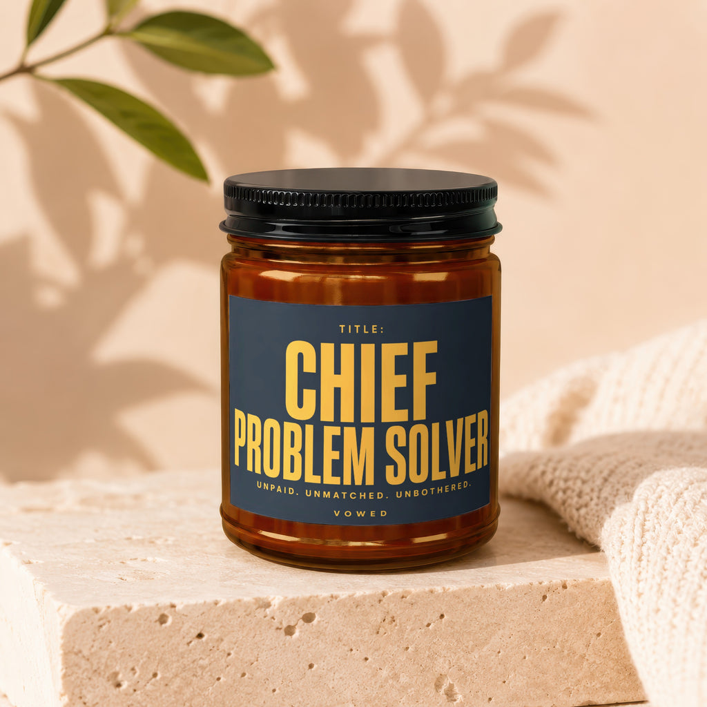Brown glass jar with dark blue label reading "CHIEF PROBLEM SOLVER".