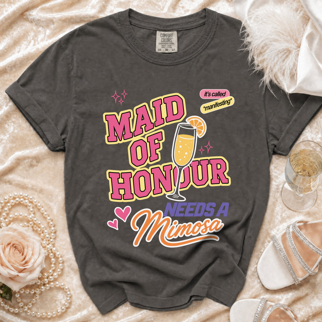 Dark grey t-shirt with "Maid of Honour Needs a Mimosa" graphic.
