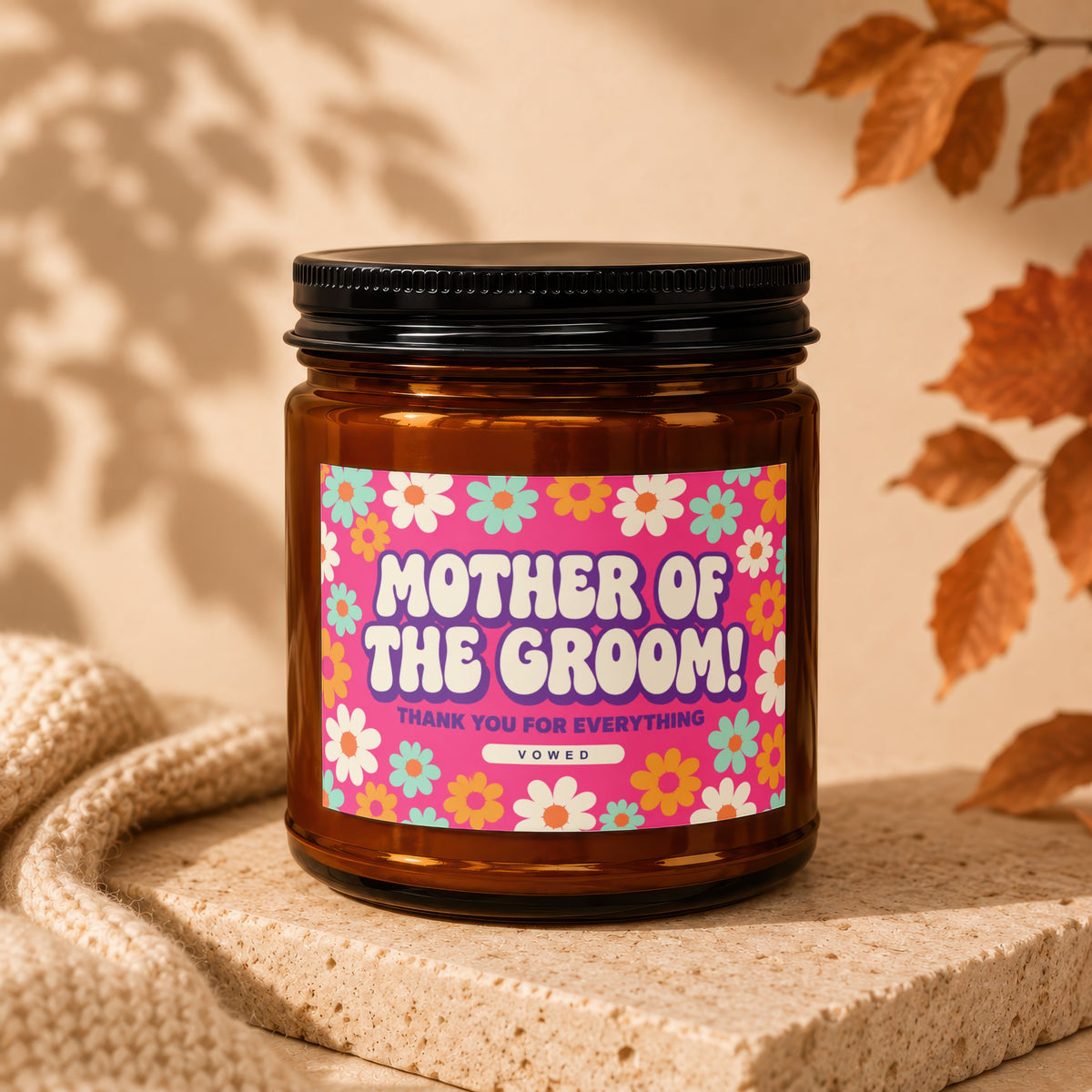 Candle with "MOTHER OF THE GROOM! THANK YOU FOR EVERYTHING" text on a retro floral label.