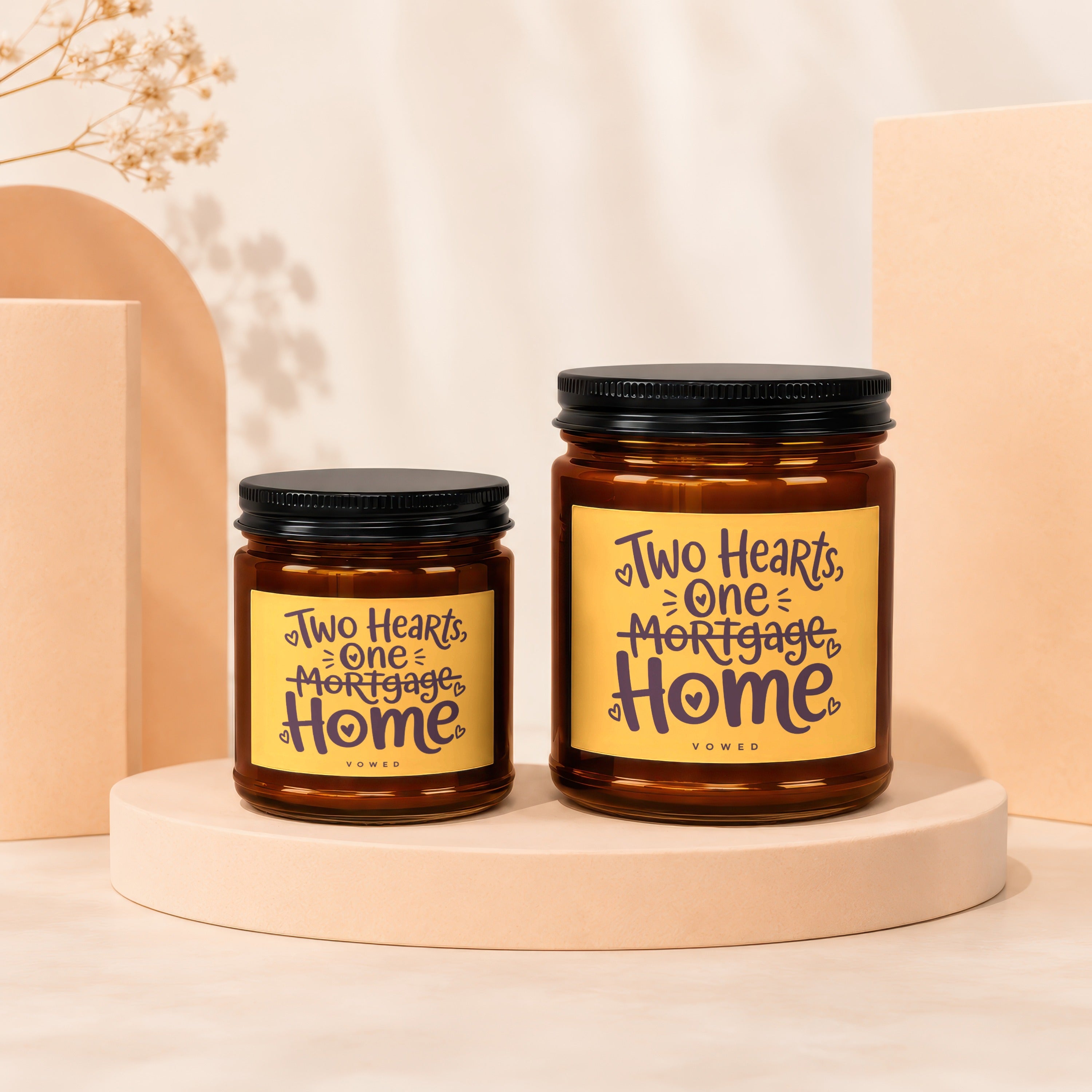 Two candles with "Two Hearts, One Mortgage Home" text on yellow labels.