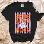 Black t-shirt with "BRIDE BEFORE BOOS" text and a ghost skull graphic.