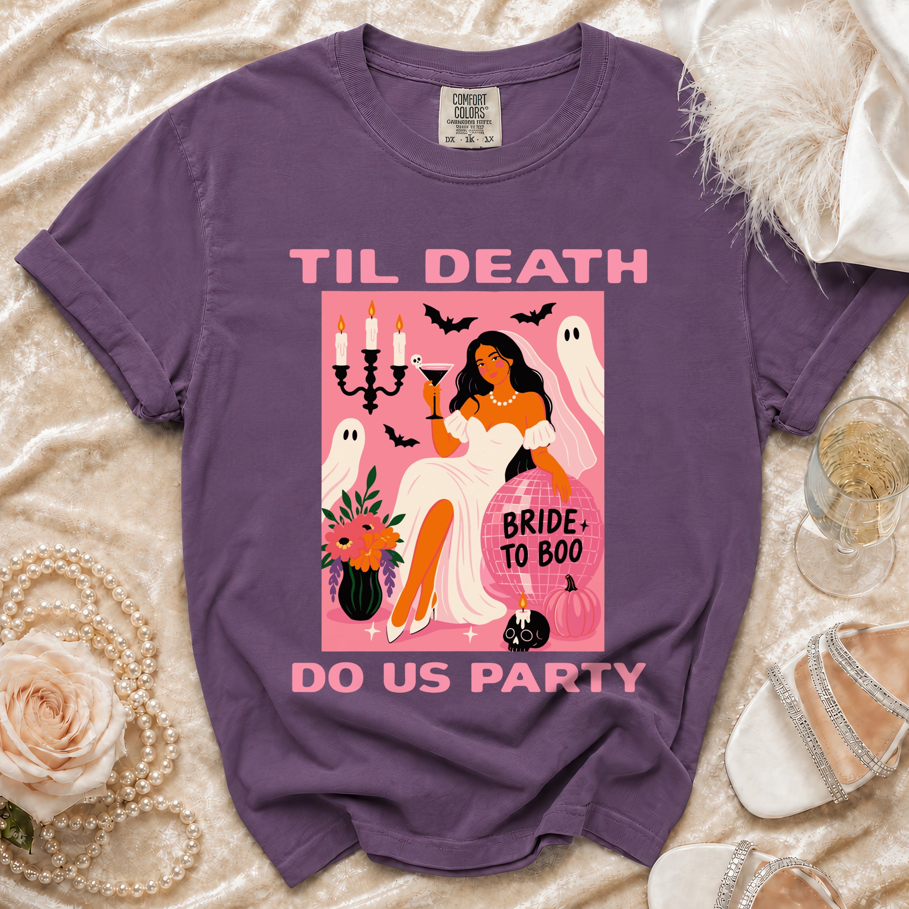 Purple t-shirt with "Til Death Do Us Party" text and bride-themed Halloween graphic.