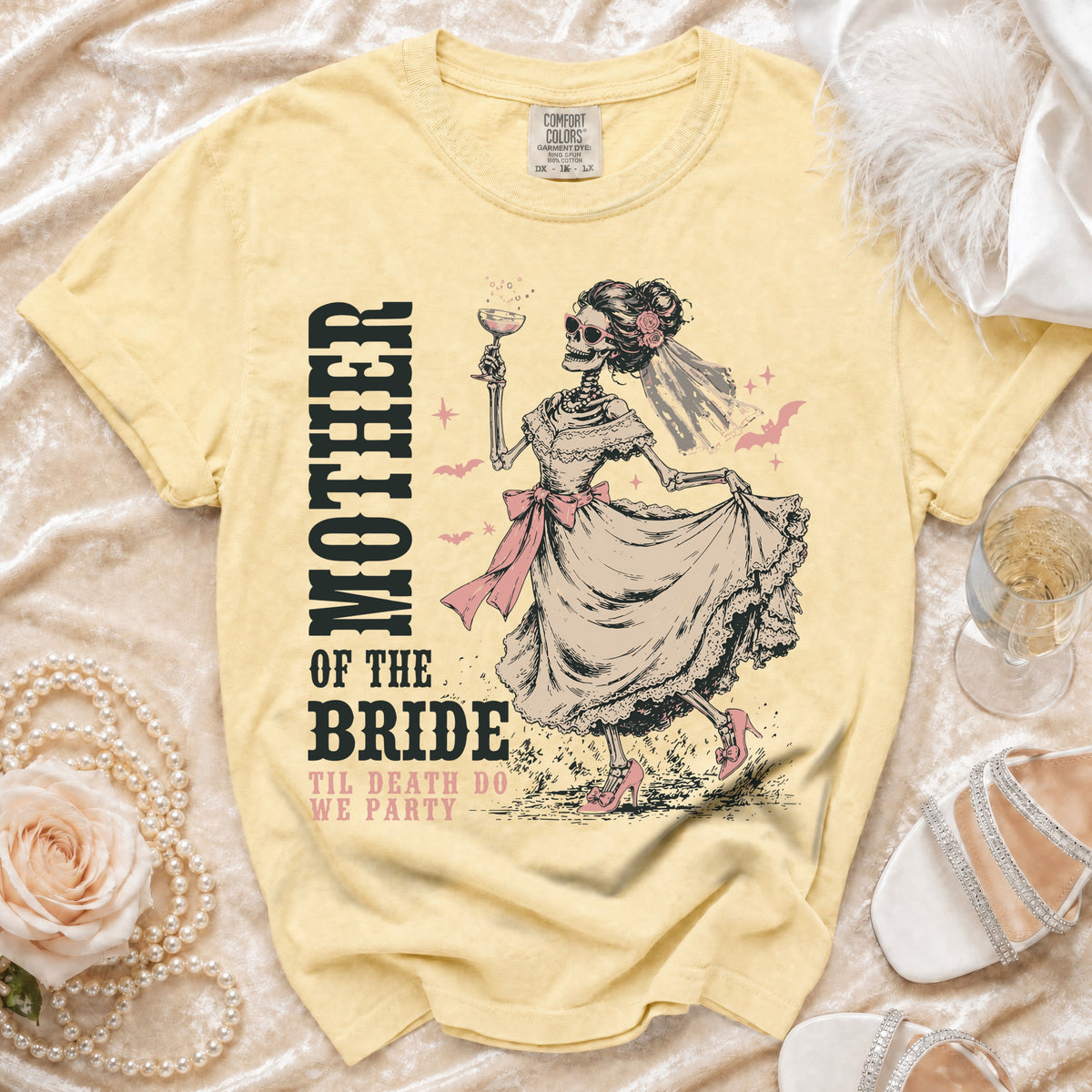Yellow t-shirt with skeleton bride graphic and text "MOTHER OF THE BRIDE TIL DEATH DO WE PARTY".