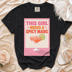 Black t-shirt with "This Girl Needs a Spicy Marg" graphic and margarita glass.