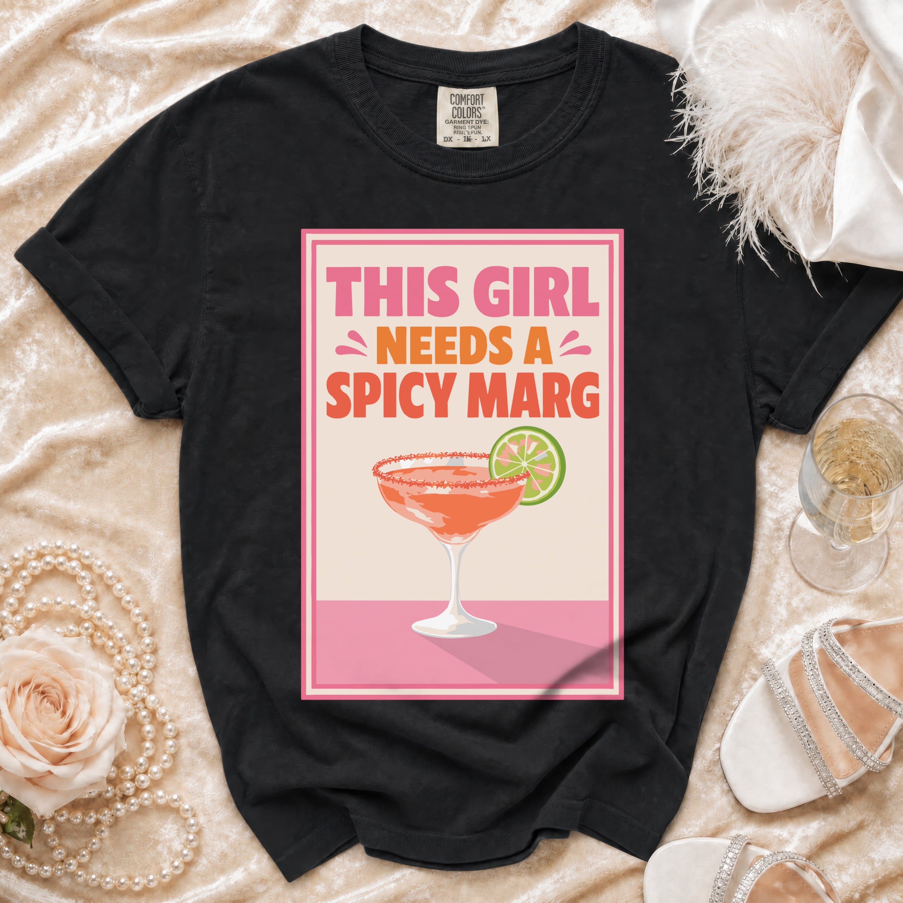 Black t-shirt with "This Girl Needs a Spicy Marg" graphic and margarita glass.