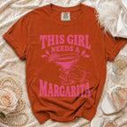 Orange t-shirt with pink text and margarita graphic.