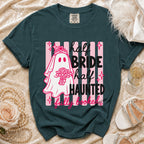 Teal t-shirt with a ghost bride graphic reading "half bride, half haunted, fully booked."