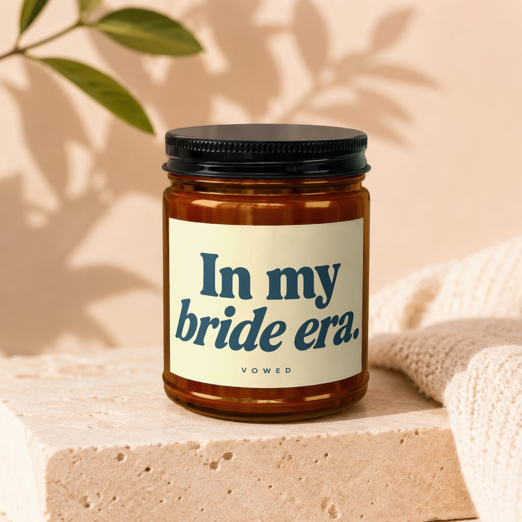 Amber candle with black lid and "In my bride era." text by vow'd.