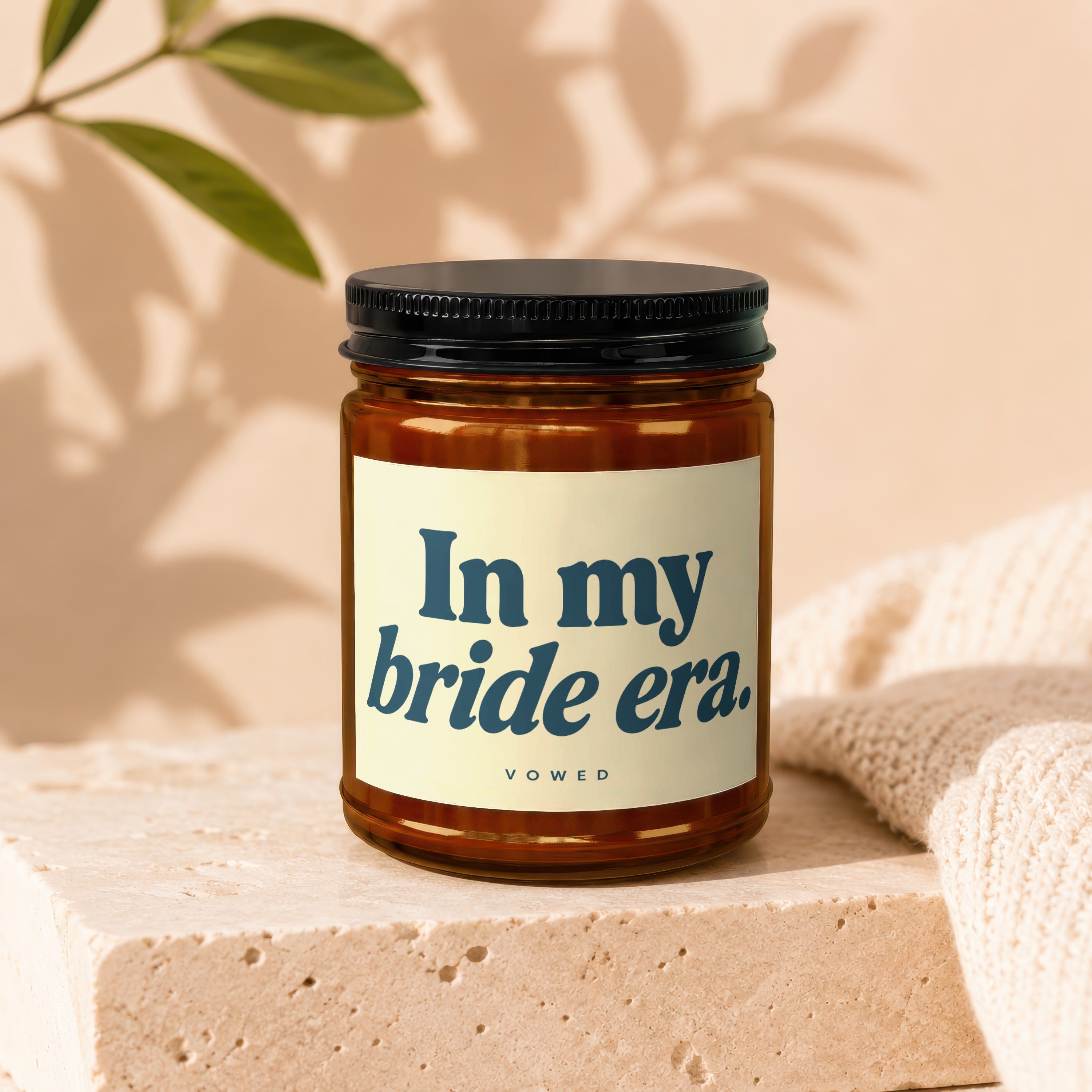 Amber candle with black lid and "In my bride era." text by vow'd.