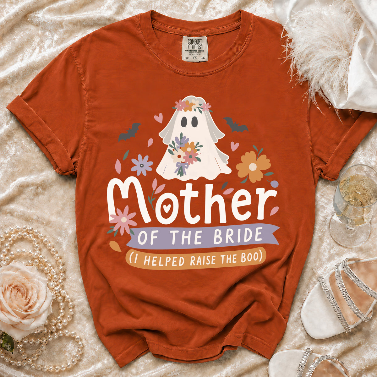 Orange t-shirt with ghost graphic and text "Mother of the Bride (I Helped Raise the Boo)".