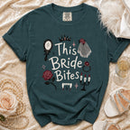 Teal t-shirt with "This Bride Bites" text and vampire-themed graphics.