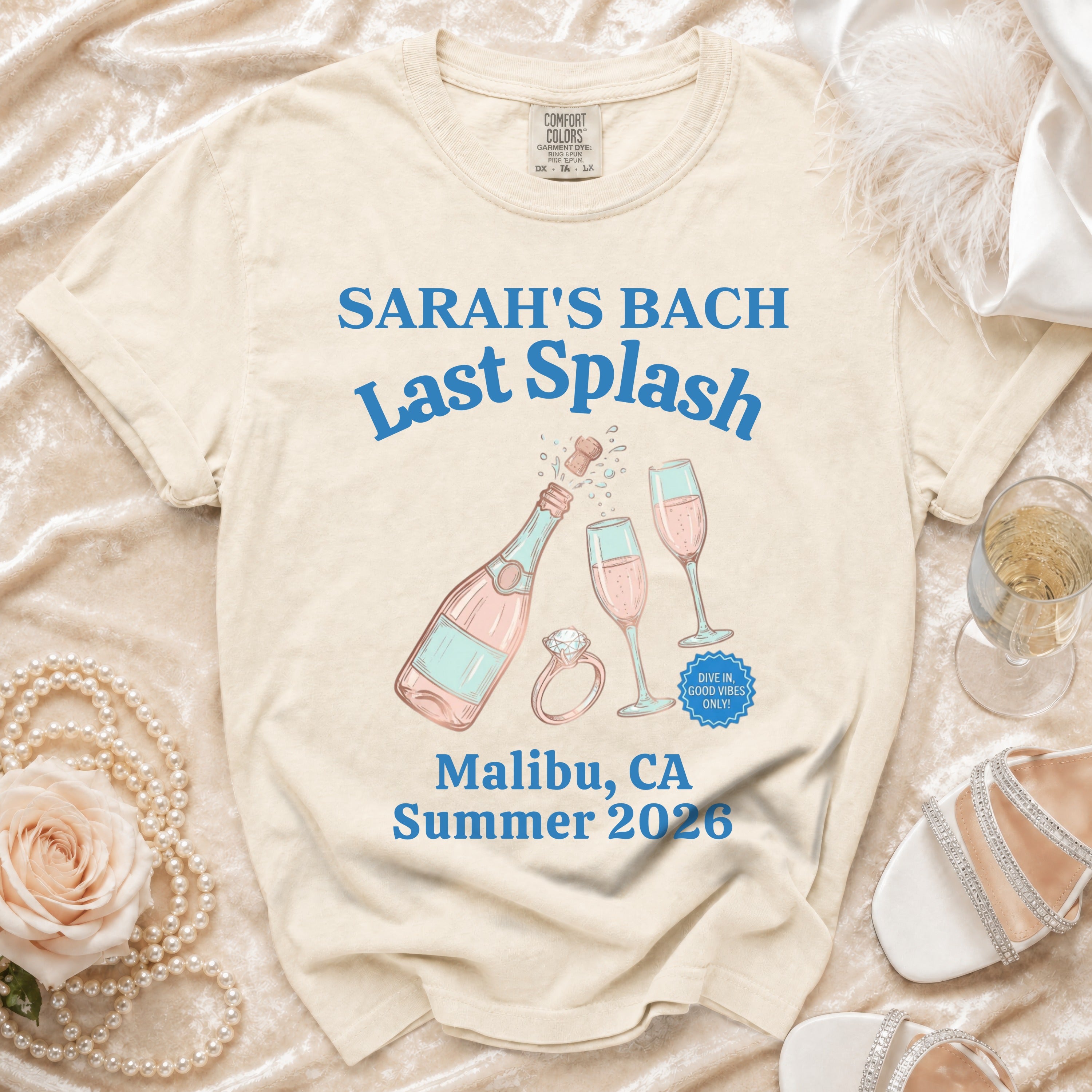 Cream t-shirt with "Sarah's Bach Last Splash" and beach/bachelorette graphics.