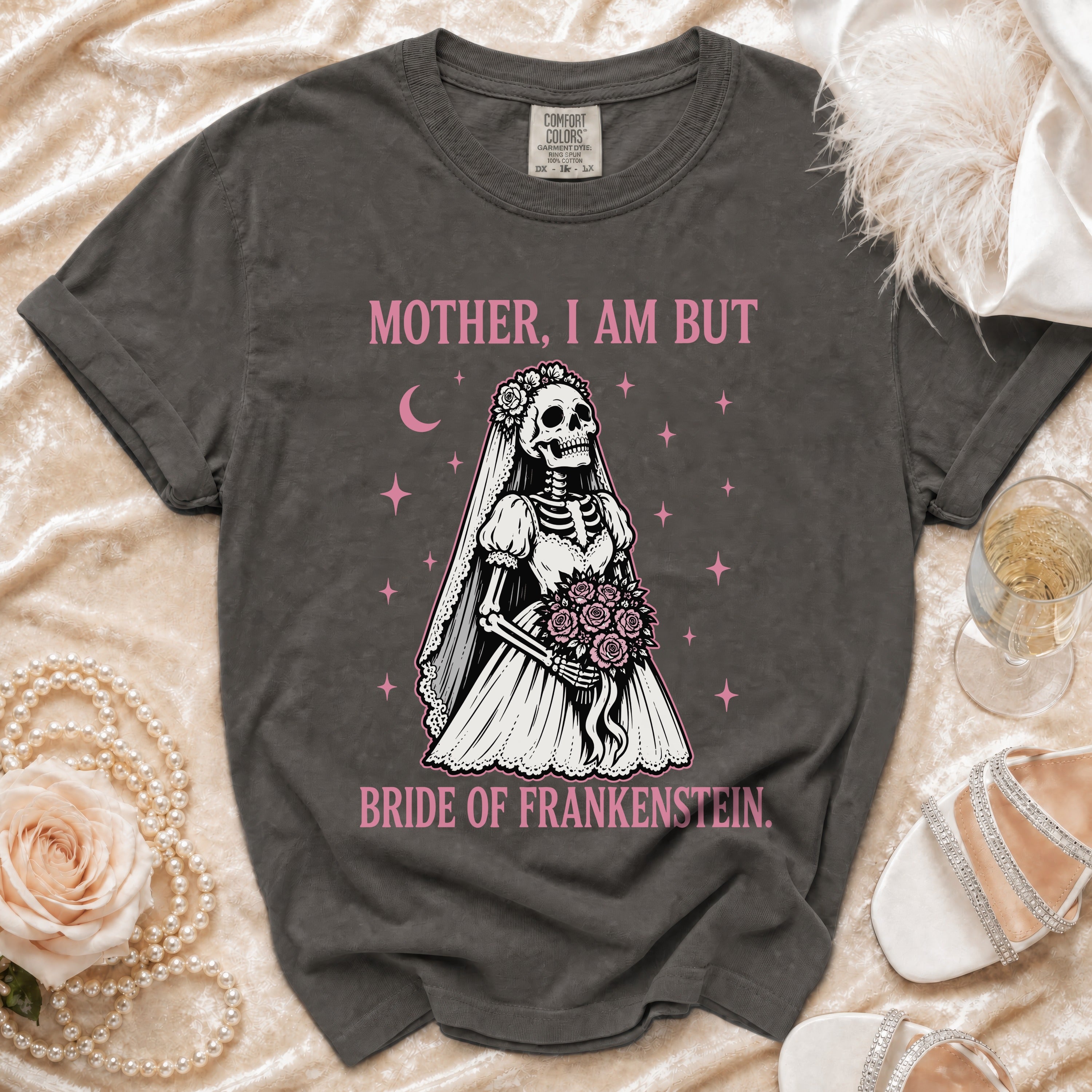 Dark gray t-shirt with skeleton bride graphic and text "MOTHER, I AM BUT BRIDE OF FRANKENSTEIN."