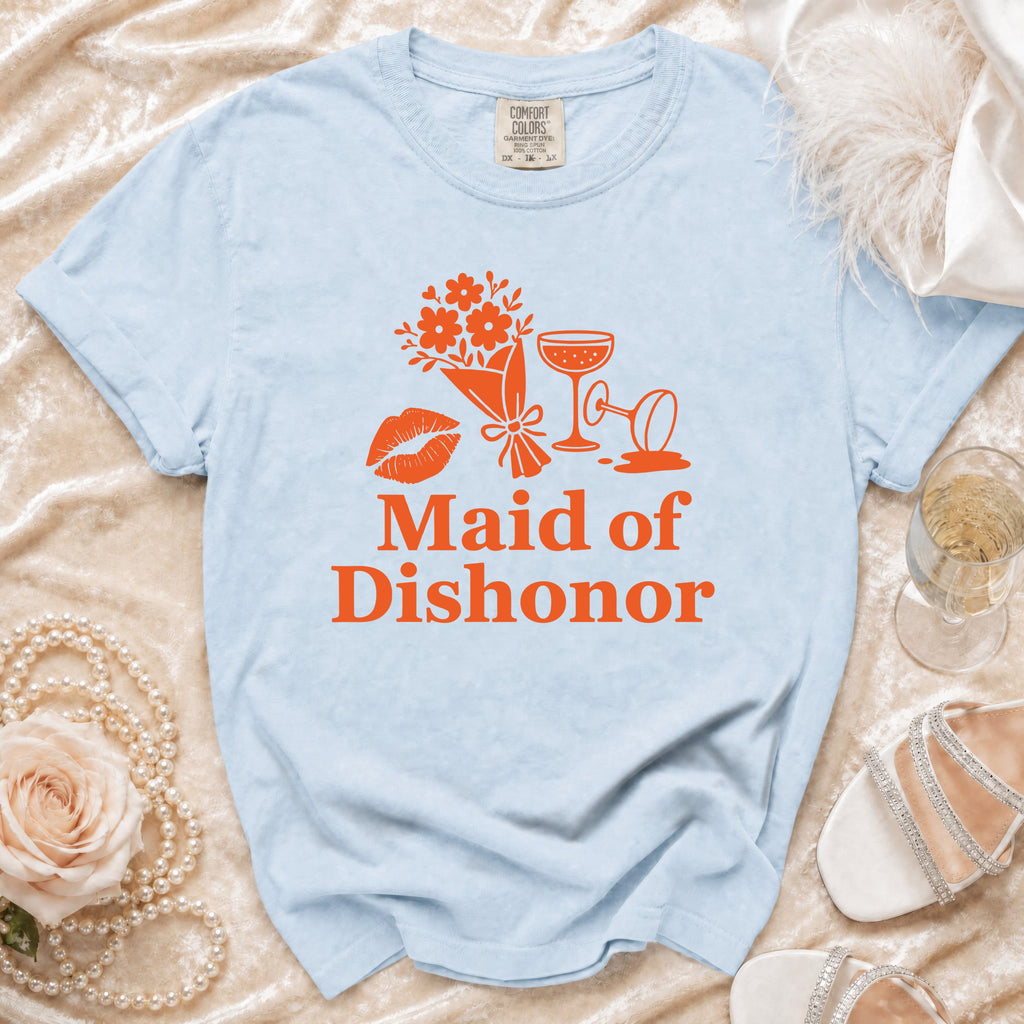 Light blue t-shirt with orange "Maid of Dishonor" text, flowers, lips, and champagne glasses.