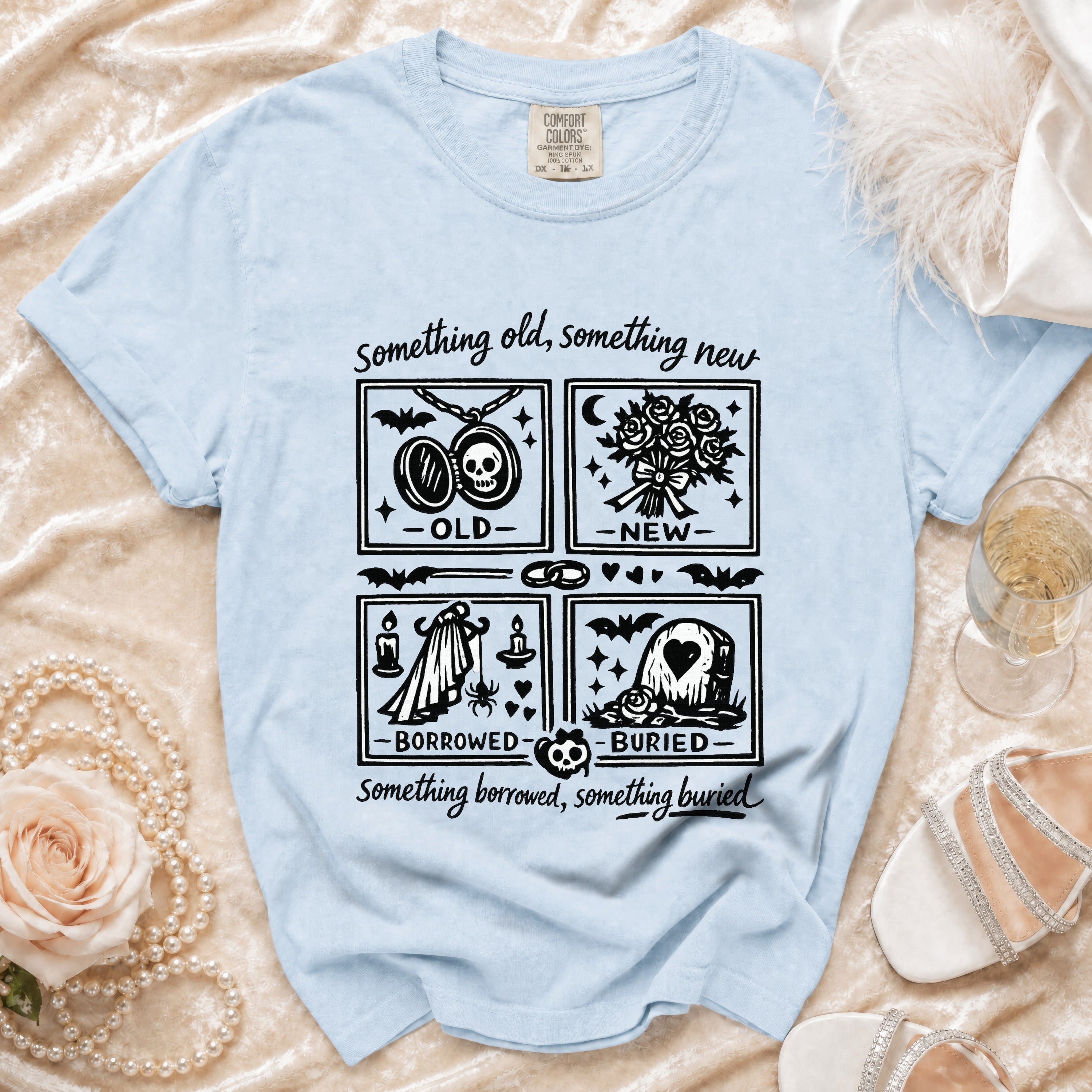 Light blue t-shirt with "Something old, new, borrowed, buried" gothic wedding graphics.