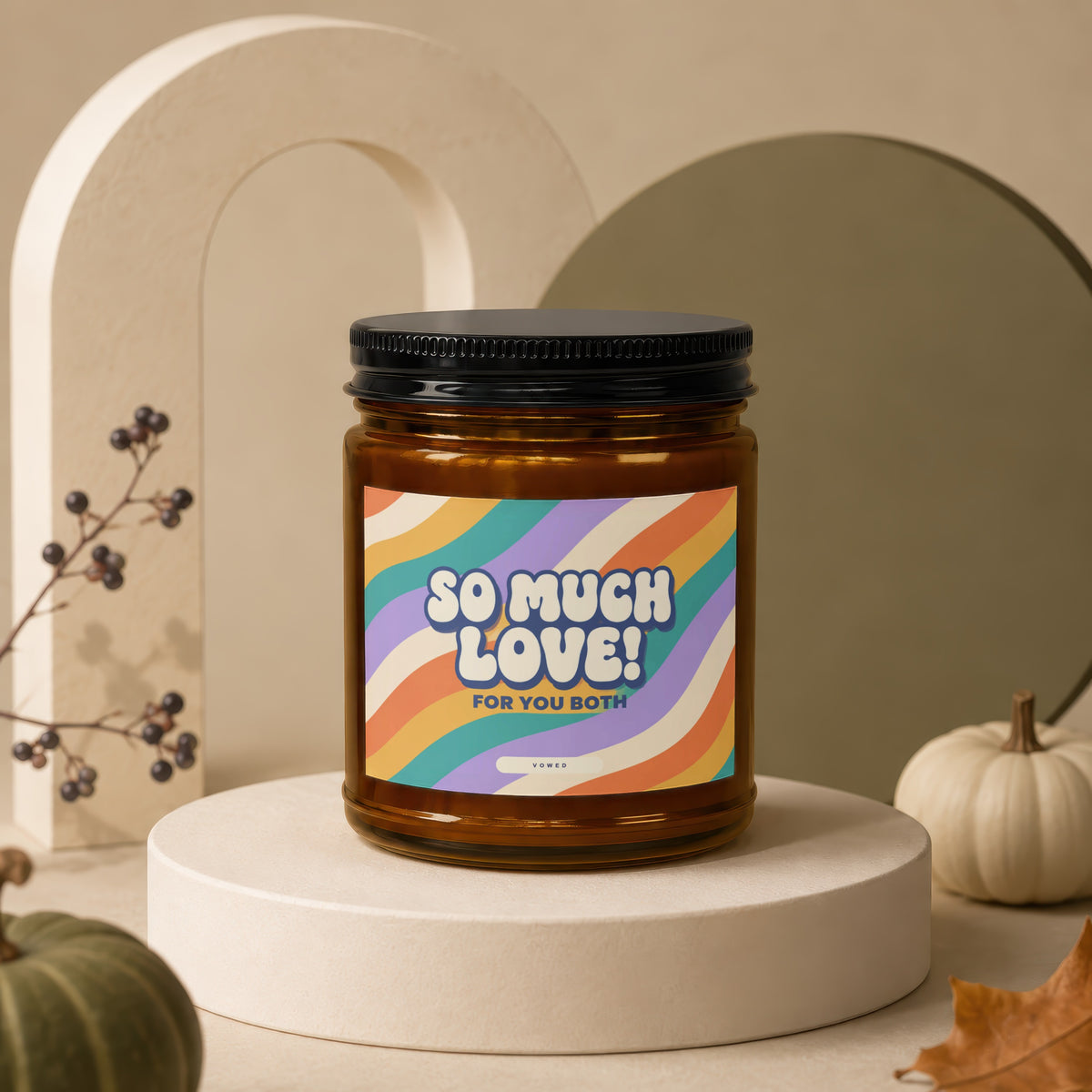 Amber candle with colorful wavy label reading "So Much Love! For You Both".