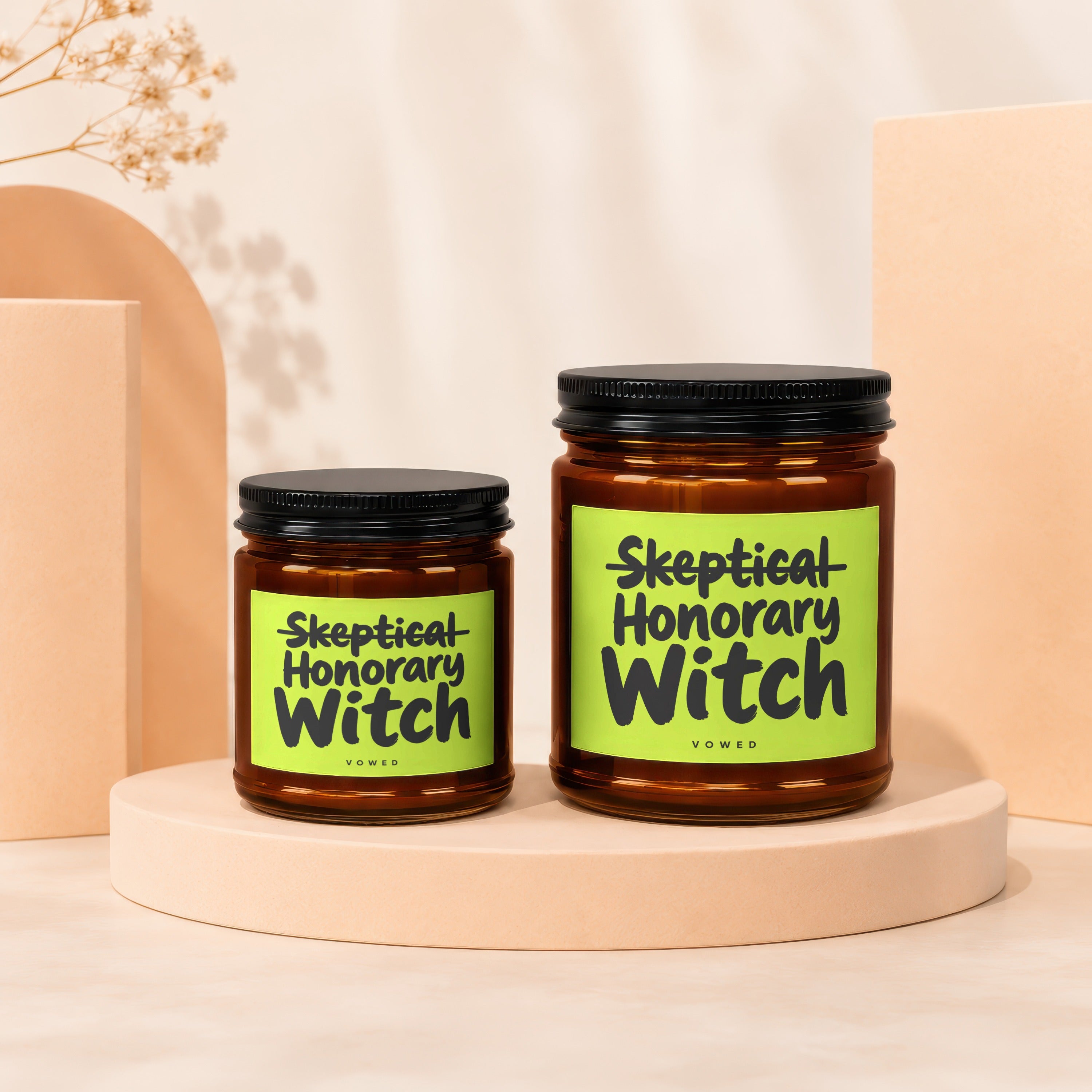 Two glass jars with black lids and "Skeptical Honorary Witch Vowed" labels.