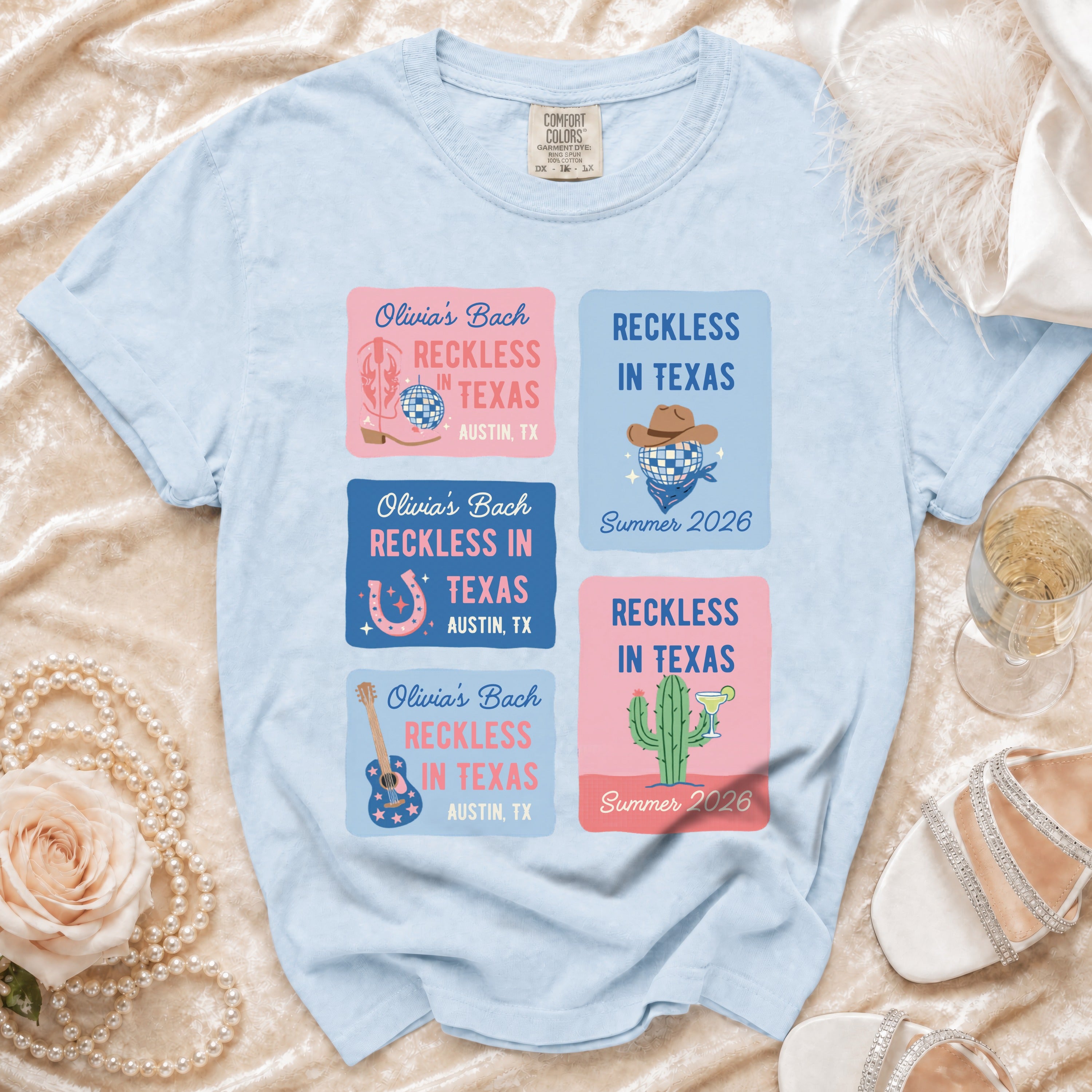 Light blue t-shirt with "Olivia's Bach Reckless in Texas" designs.