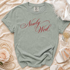 Light green t-shirt with "Newly Wed" in red script and Comfort Colors tag.