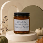 Amber candle with black lid and label reading "Of All the Internet Weirdos, You're My Favorite".